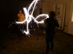 FZ024577 Jenni and Phill setting of sparklers in the garden.jpg